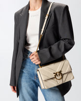 Medium Love Bag pebbled leather crossbody bag with V-shaped pattern and logo - White | Pinko