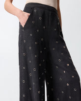 Wide-leg jeans in dark denim with eyelets - | Pinko