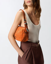 Medium crossbody bowler bag in crocodile-print leather - Orange | Pinko