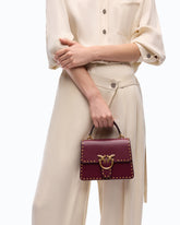 Mini Love Bag One Top Handle Light handbag in leather with mini studs - | Pinko