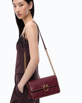 Medium Love One Slouchy crossbody bag in leather with studs - Pink | Pinko