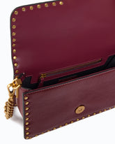 Small Love One Slouchy crossbody bag in leather with studs - Pink | Pinko