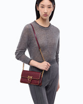 Small Love One Slouchy crossbody bag in leather with studs - Pink | Pinko