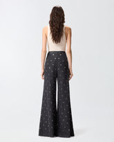 Jeans mit weitem Bein aus dunklem Denim mit Ösen -  | Pinko