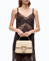 Love Bag One Top Handle Light medium handbag in leather with mini studs -  | Pinko