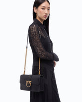 Love Bag One medium crossbody bag in leather with jewel buckle - Black | Pinko