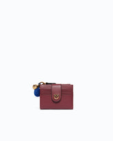 Multi-purpose leather wallet with pompom -  | Pinko