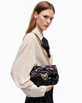 Mini Love Bag Puff crossbody bag in quilted new shiny leather - Black | Pinko